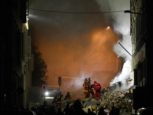 Rescue workers at the scene of a building collapse in Marseilles. Picture: Nicolas Tucat/AFP