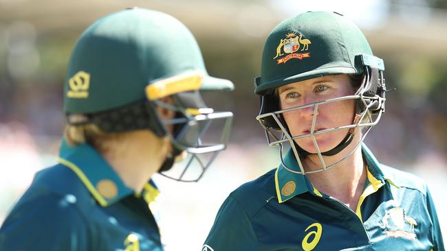 CANBERRA, AUSTRALIA - JANUARY 28:  Alyssa Healy and Beth Mooney of Australia talk before walking out to open the batting during game two of the Women's T20 International series between Australia and South Africa at Manuka Oval on January 28, 2024 in Canberra, Australia. (Photo by Mark Metcalfe/Getty Images)