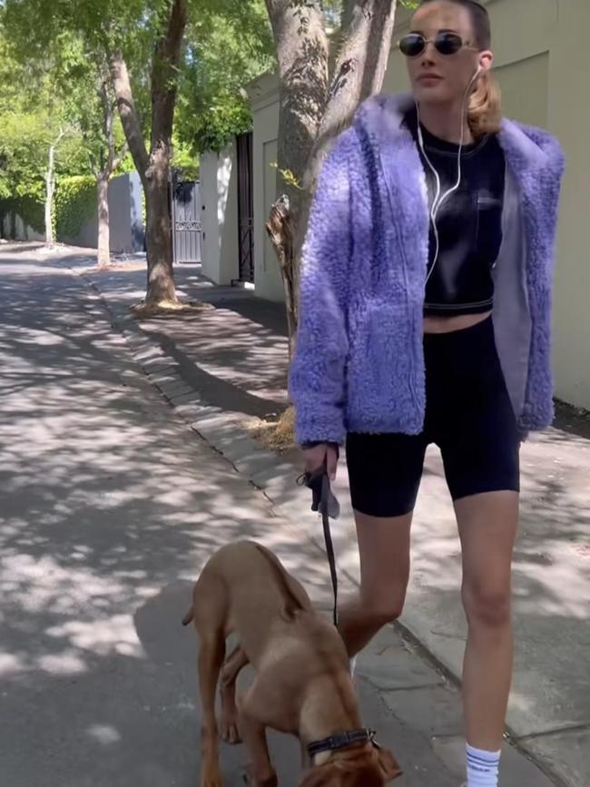 Bec Judd walking the streets of Brighton with her Rhodesian ridgeback