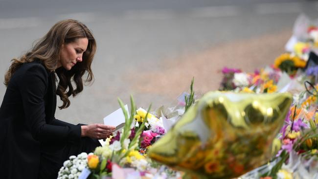 Catherine, Princess of Wales looks at floral tributes outside Norwich Gate on the Sandringham Estate. Picture: AFP