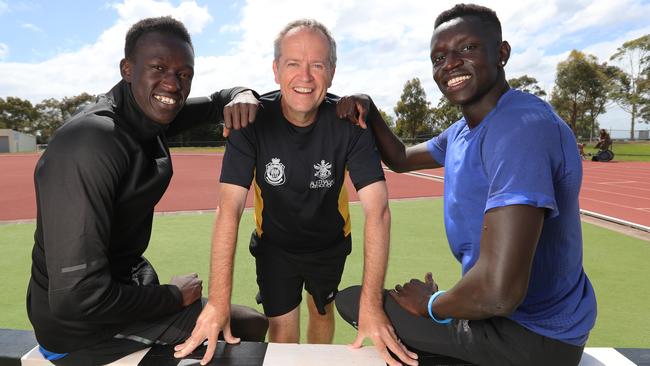 Australian 800m record holder Joseph Deng (left) and training partner Peter Bol with Opposition Leader Bill Shorten. Picture: Alex Coppel