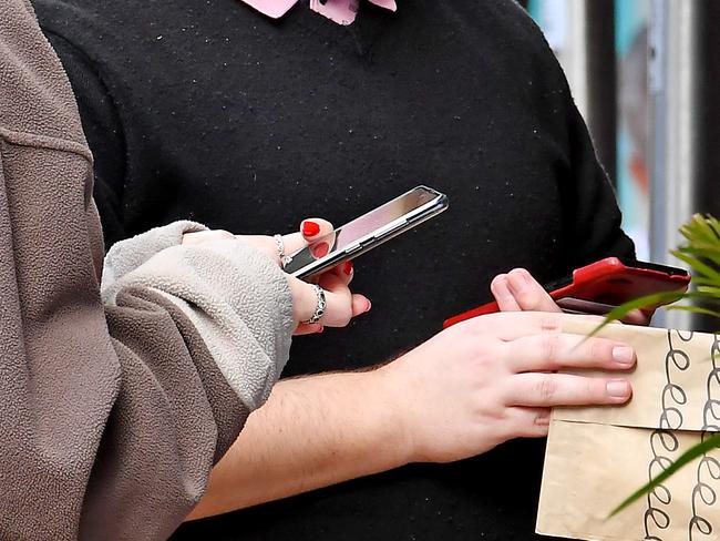 BRISBANE, AUSTRALIA - NewsWire Photos JUNE 28, 2021: Brisbane people use QR codes in Southbank as more restrictions were announced today for Brisbane as authorities announce even tougher Covid-19 restrictions. Picture: NCA NewsWire / John Gass