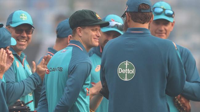 Matt Kuhnemann is congratulated after receiving his cap.