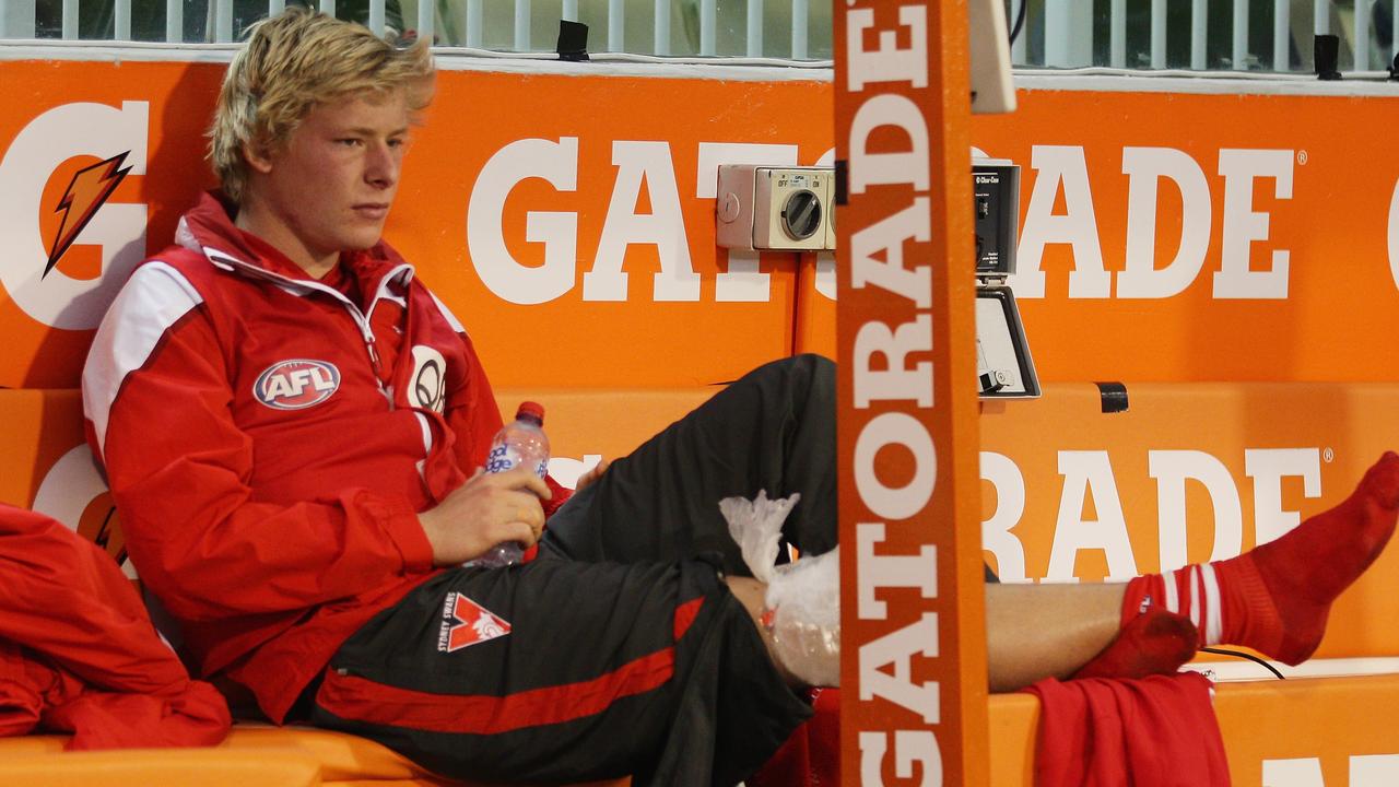 MELBOURNE, AUSTRALIA - MAY 09: Isaac Heeney of the Swans sits on the bench with an injured leg during the round six AFL match between the Melbourne Demons and the Sydney Swans at Melbourne Cricket Ground on May 9, 2015 in Melbourne, Australia. (Photo by Scott Barbour/Getty Images)