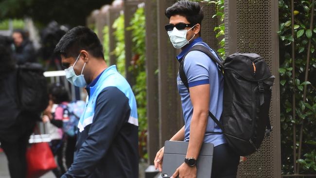 India's Shubman Gill, right,leaves the team's hotel in Melbourne on Monday. Picture: AFP