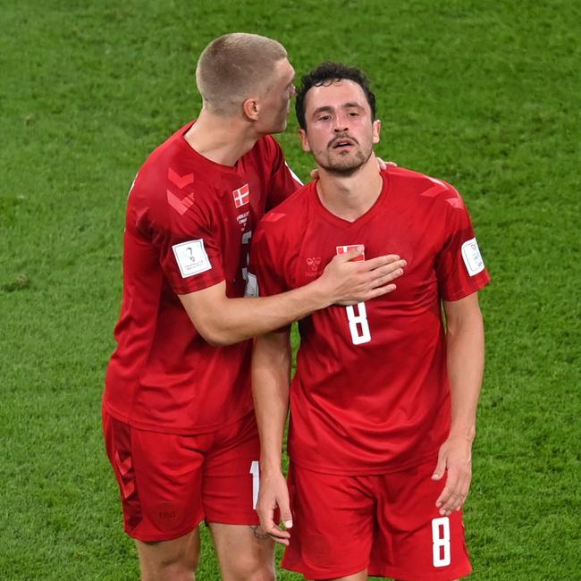 Thomas Delaney is comforted after being subbed off against Tunisia.