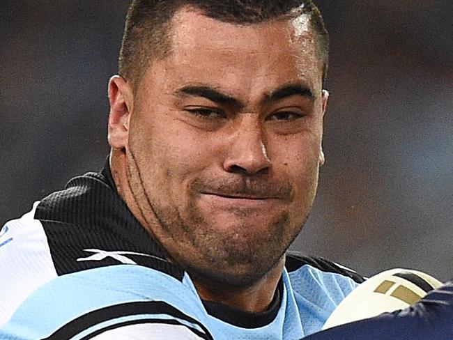 Andrew Fifita of the Sharks is tackled by Cheyse Blair of the Storm during the NRL Grand Final between the Melbourne Storm and the Cronulla-Sutherland Sharks at ANZ Stadium in Sydney, Sunday, Oct. 2, 2016. (AAP Image/Dan Himbrechts) NO ARCHIVING, EDITORIAL USE ONLY