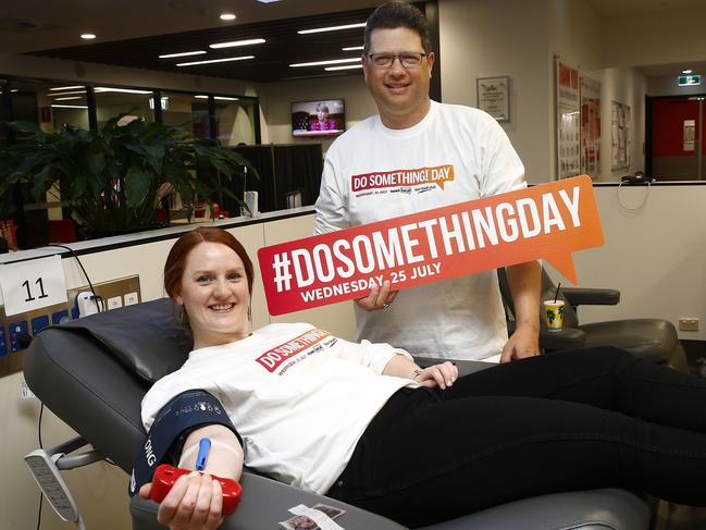 News Corp retail marketing executive Sarah Watson and <i>Southern Courier</i> editor Antony Field give blood at the Red Cross blood donor centre in Hunter St in Sydney CBD. Picture: John Appleyard