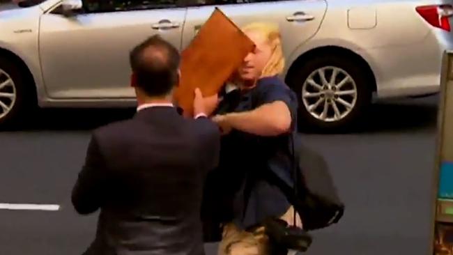 The break came after his married breakdown and a number of incidents including this scuffle with a photographer outside court. Picture: AAP