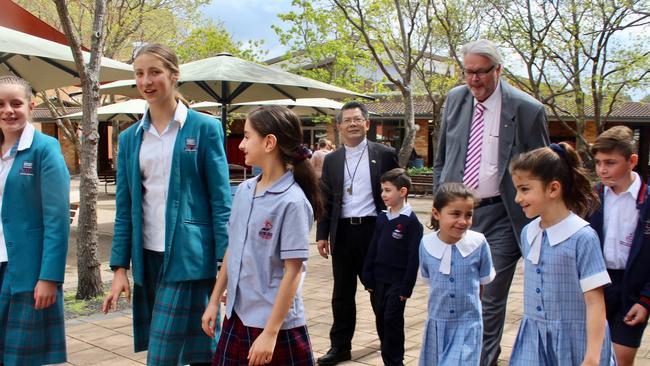 Catholic Education executive Greg Whitby with local students.