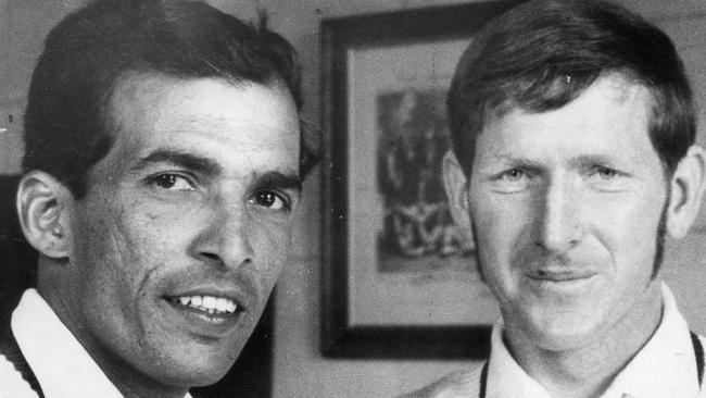 Rusi Surti (l), playing for Queensland, having a Coca-Cola with Qld teammate Bill Albury after Surti took 5/103 and Albury 4/50.