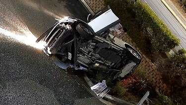 The moment the vehicles driver manages to escape through the passenger side door.