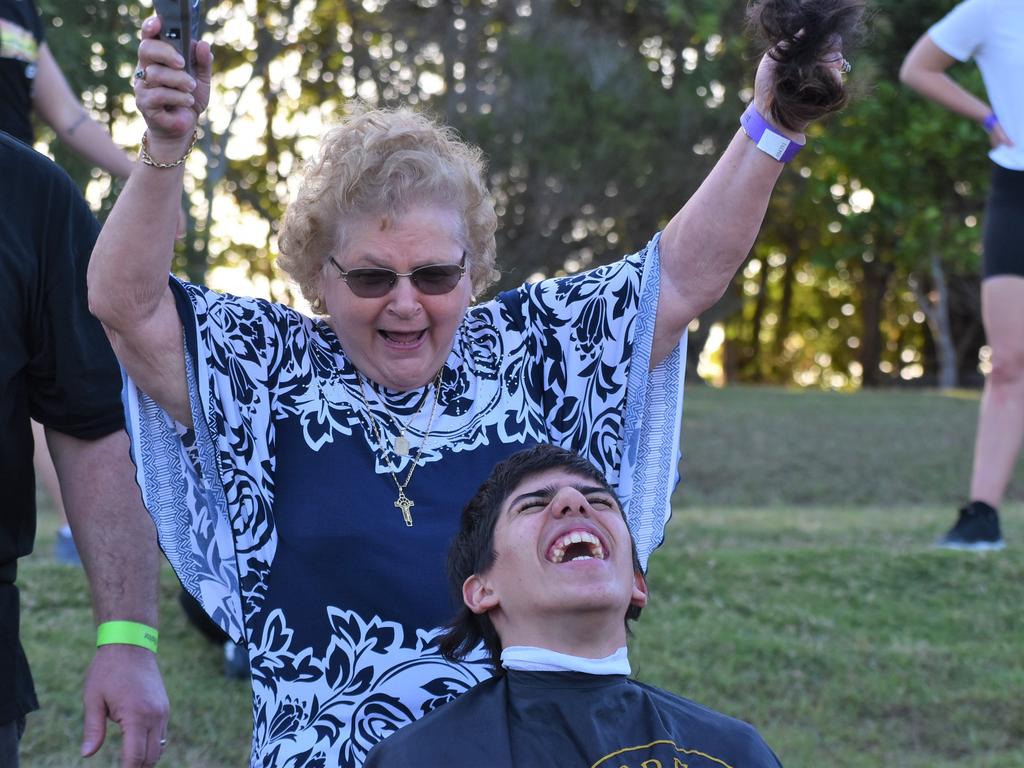 Great-grandmother Mary Vella made the first cut on her great-grandson Dean Grech's mullet at the Mackay Pioneer Valley Relay For Life, September 2021. Picture: Lillian Watkins