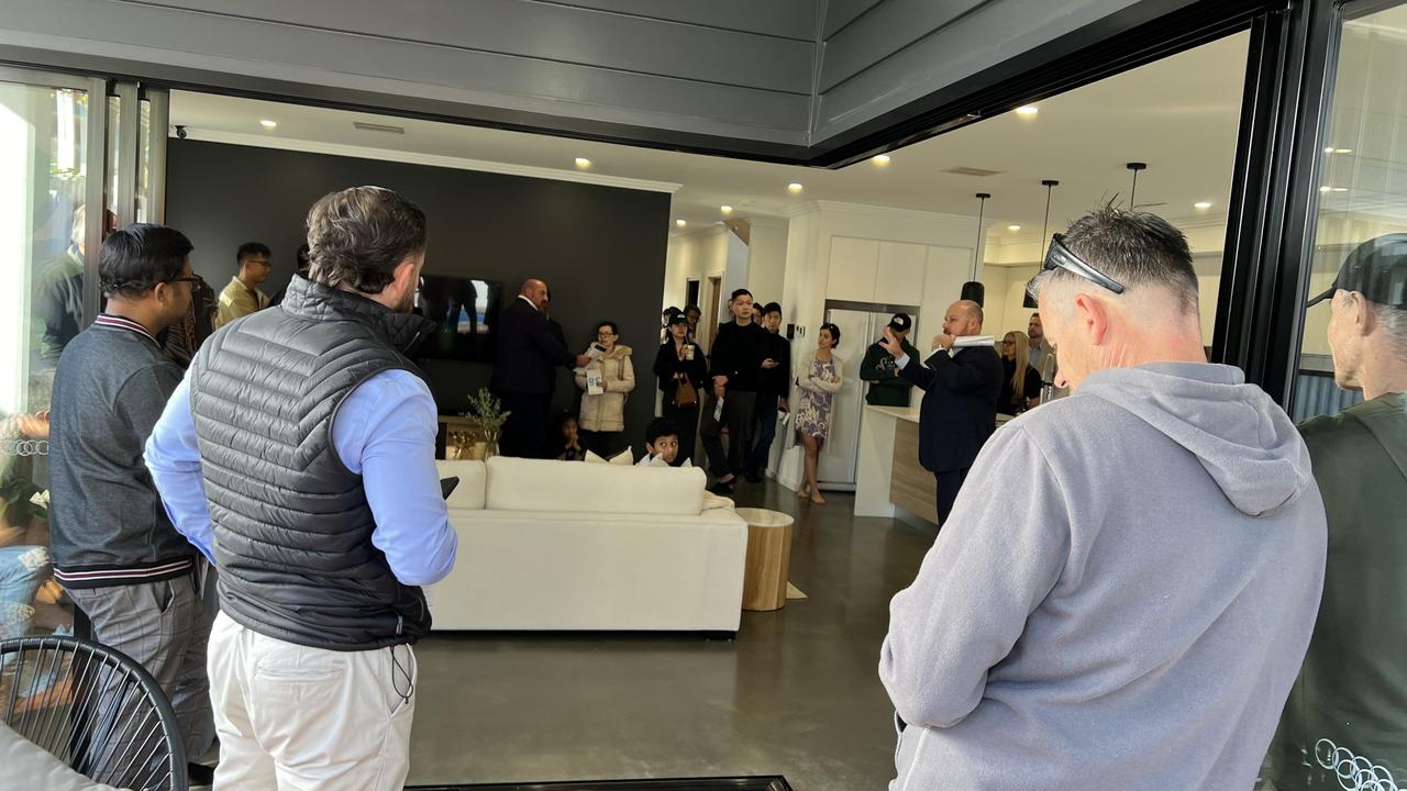 Near the end of the bidding, the chatter between bidders and onlookers died down, the silence tense as each bidder made their final offers. Picture: Nicholas Finch