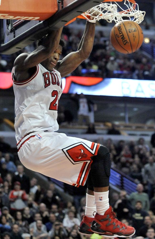 Chicago’s Jimmy Butler dunks during the second half against Denver.