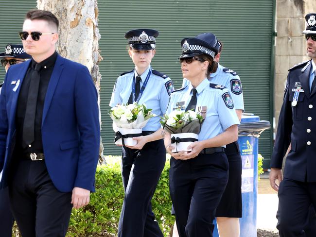 Mourners at the memorial service with full police honours for constables Rachel McCrow and Matthew Arnold at Brisbane Entertainment Centre. Picture: Steve Pohlner