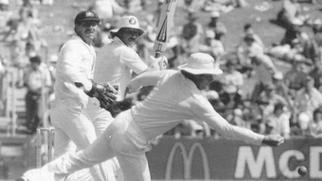 Greg Chappell narrowly misses a slips catch off England’s Ian Botham in the 1983 New Year Test at the SCG as wicketkeeper Rod Marsh looks on.