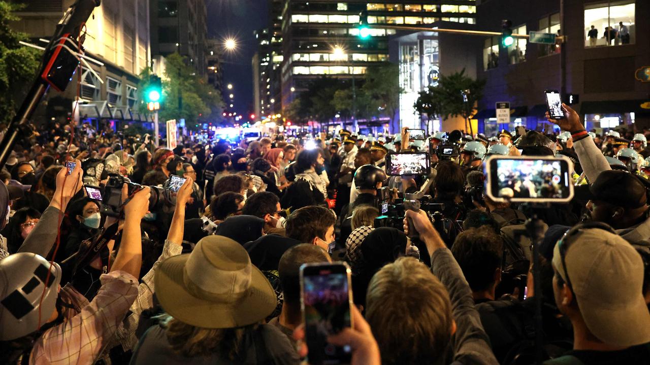 Police line up amid a protest at the Israeli consulate. Picture: AFP