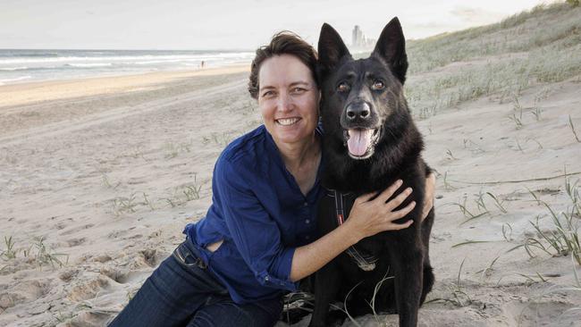 Forensic scientist Kirsty Wright with her German shepherd Ava at Main Beach, Surfers Paradise, this week. Picture: Glenn Hunt