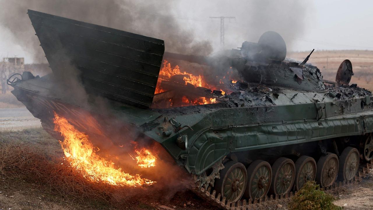 A military vehicle, belonging to Assad’s forces, burns. Picture: Omar Haj Kadour/AFP