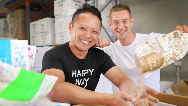 Ben (R) and Hien, who are behind the local Happy Way vegan protein products. (AAP Image/Dean Martin)