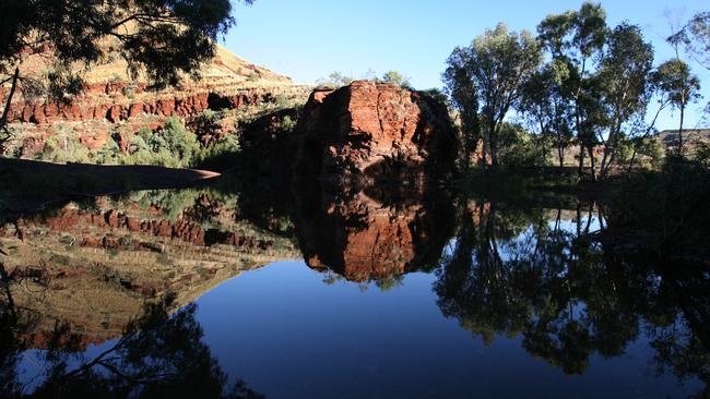 A tailings dump of asbestos which was originally covered in tar to stop it moving at Wittenoom Gorge.