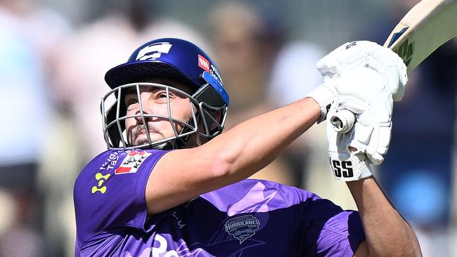 HOBART, AUSTRALIA - JANUARY 15: Tim David of the Hurricanes hits a six during the Men's Big Bash League match between the Hobart Hurricanes and the Sydney Thunder at Blundstone Arena, on January 15, 2023, in Hobart, Australia. (Photo by Steve Bell/Getty Images)