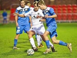 IN CONTROL: South West Queensland Thunder midfielder Daniel Weber (right) eases past Magpies Crusaders FC player Ezra Kennell during their NPLQ clash at Toowoomba's Clive Berghofer Stadium on Saturday. The match finished in a 1-1 draw. Picture: Nev Madsen