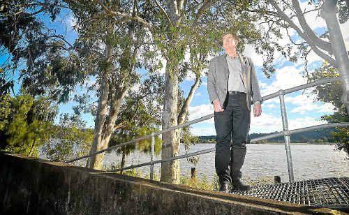 Andrew Baker in front of the riverbank at the rear of the Maclean CBD. Picture: Adam Hourigan