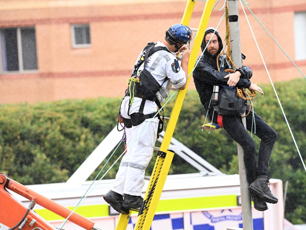 A 33-year-old protester was arrested after suspending himself on rail lines on Thursday. Picture: Jeremy Piper