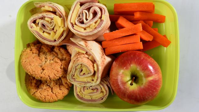 Lunchbox Two: Crazy cranberry ANZAC biscuits, ham and cheese wrap, apple and carrot sticks.