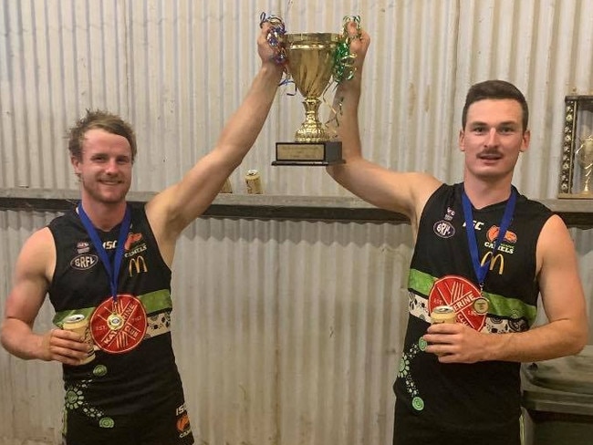 Katherine Camels star Josh Carlin, right, pictured celebrating his team's Big Rivers League premiership triumph last year. Picture: FACEBOOK