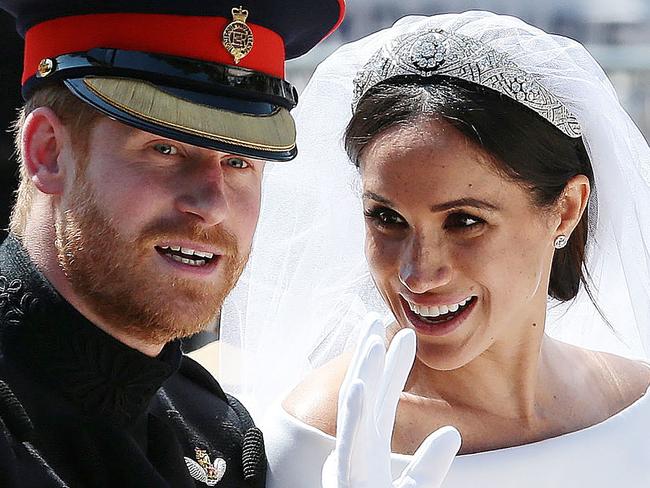 The Duchess of Sussex, right, is said to be eyeing a fashion career with the brand that designed her wedding dress. Picture: AFP