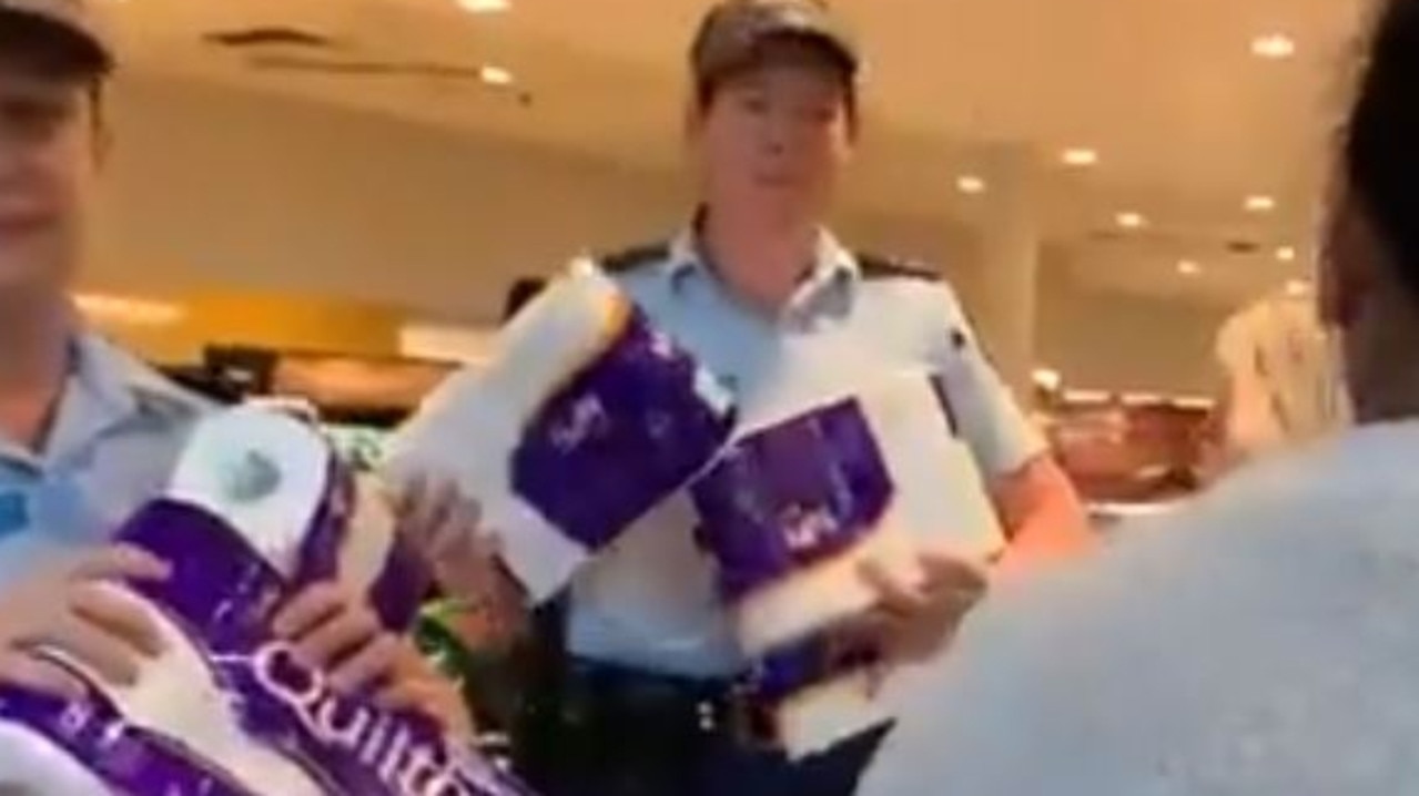 Police officers distributed toilet paper and paper towels at a Sydney supermarket in a bid to calm coronavirus-related panic buying. Picture: Twitter