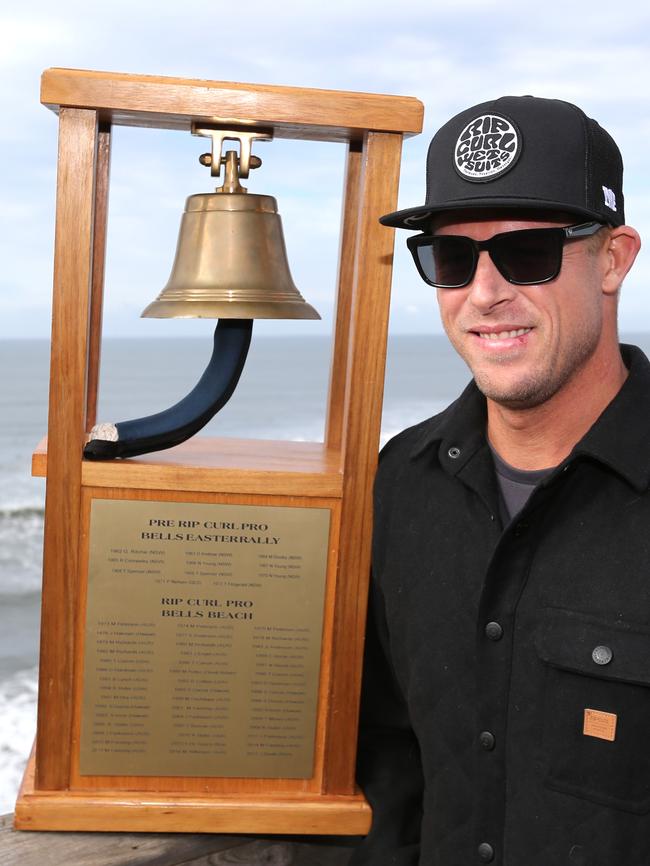 Mick Fanning and the bell trophy.