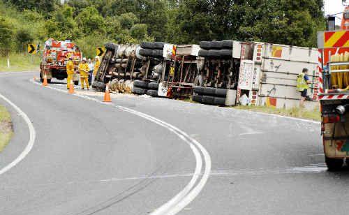 The Casino driver of this semi-trailer escaped injury yesterday when it rolled on to its side on the Lismore-Bangalow Road near Binna Burra. The accident happened just after midday and traffic was disrupted for several hours. . Picture: Jay Cronan