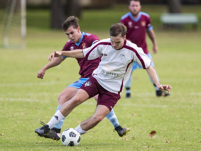 Matt Carey (front) for Warwick Wolves and Brandon Walker of St Albans in Toowoomba Football League Premier Men round eight at Middle Ridge Park, Sunday, May 9, 2021. Picture: Kevin Farmer