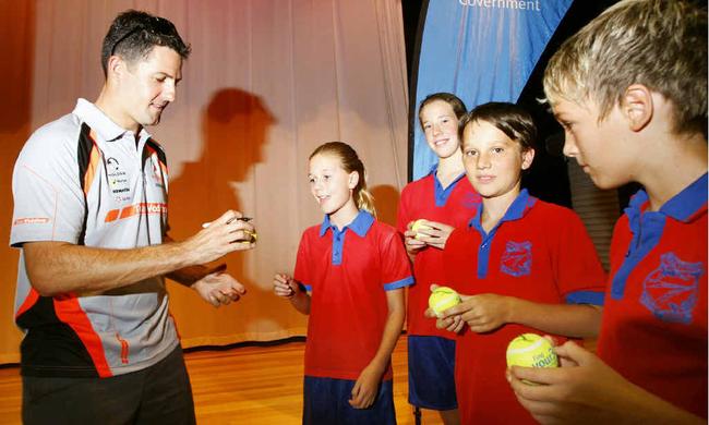 V8 Supercar champion Jamie Whincup signs autographs for Karalee State School captains (from left) Reegan Johnstone, Michaela Berlin, Robin Liney and Sebastian Scaroni for Super Sports Sign-On Day. 