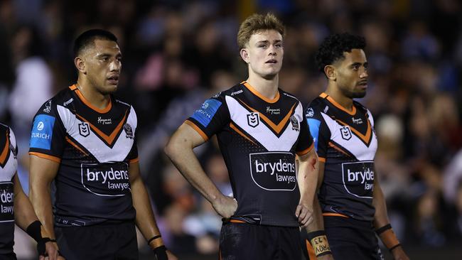 SYDNEY, AUSTRALIA - JULY 12:  Lachlan Galvin of the Wests Tigers reacts after a Sharks try during the round 19 NRL match between Cronulla Sharks and Wests Tigers at PointsBet Stadium on July 12, 2024, in Sydney, Australia. (Photo by Brendon Thorne/Getty Images)