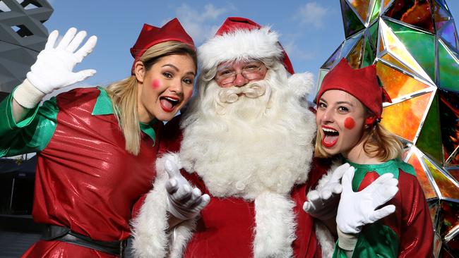 Santa takes a break with his elves at Eastland. Picture: Stuart Milligan