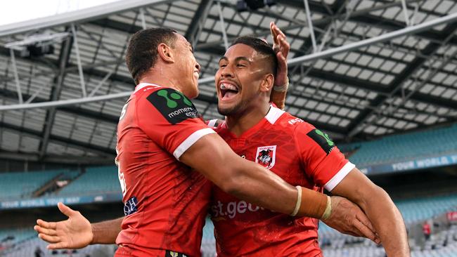 Nene MacDonald (right) of the Dragons is congratulated by Tyson Frizell after scoring a try during the round 5 NRL match between the West Tigers and the St George Illawarra Dragons at ANZ Stadium in Sydney on Sunday, April 2, 2017. (AAP Image/Paul Miller) NO ARCHIVING, EDITORIAL USE ONLY