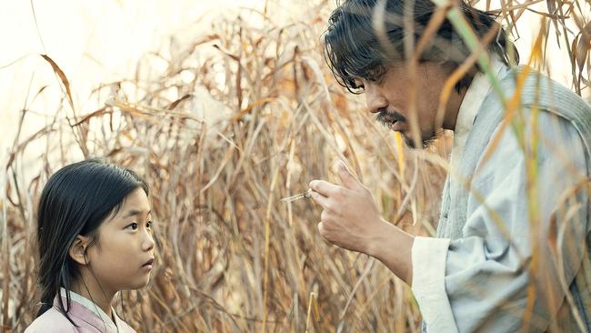 A scene from the first episode of Pachinko, featuring young Sunja and her father Hoonie.