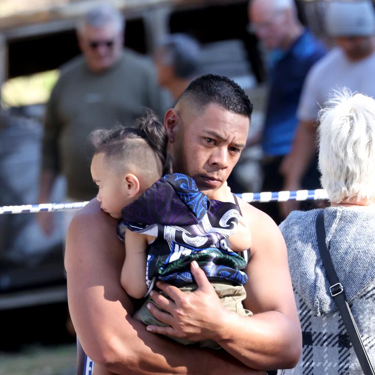 A traditional Maori memorial ceremony where the fatal fire took six lives, at the scene where Police and Emergence services attend have investigated a Russell Island house fire where Wayne Godinet and five children died. Picture: Steve Pohlner