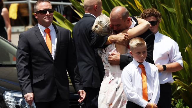 Mother Simone Tickle hugs a friend.