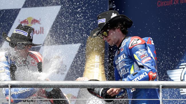 Jack Miller and Alex Rins celebrate on the podium. Picture: AP