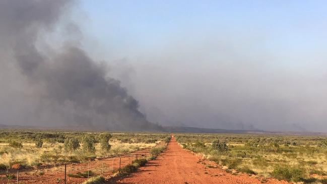 Volunteers and staff from Bushfires NT continue to battle out-of-control blazes in and around the lytwelepenty/Davenport Ranges National Park in Davenport. The national park will remain closed until at least November 4 as the fire is brought under control.