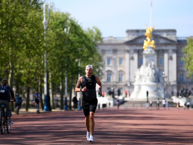 Runners run down The Mall in London. Picture: Getty Images