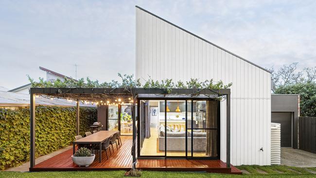 The striking extension creates a spacious entertainment area in the back yard.