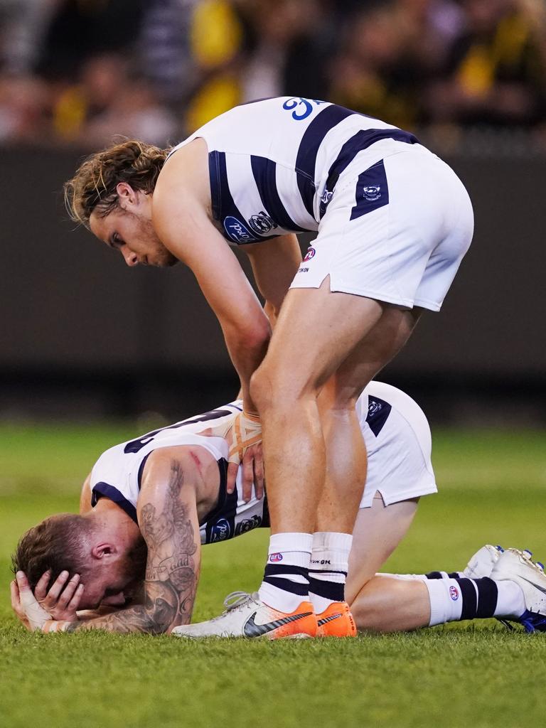 Zach Tuohy is comforted Jake Kolodjashnij after Geelong’s preliminary final loss in 2019.