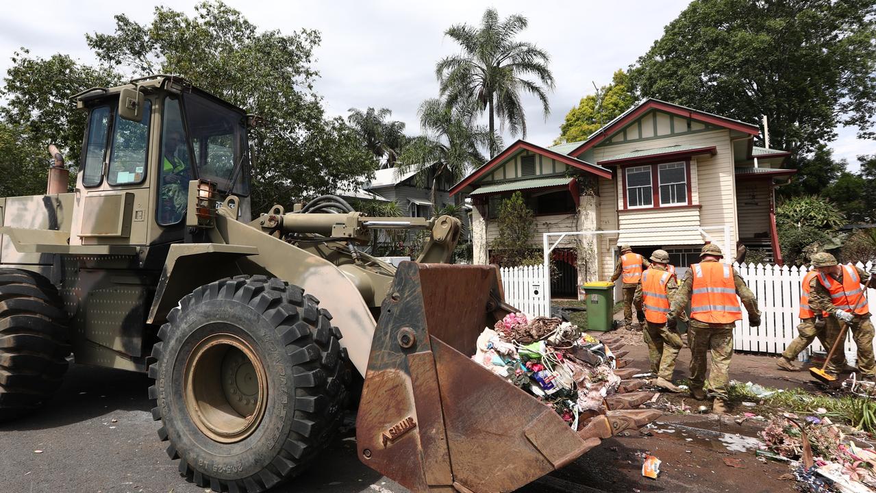 Defence Force Personel assist with the clean up in Lismore in the aftermath of the devastating floods. Photograph: Jason O'Brien